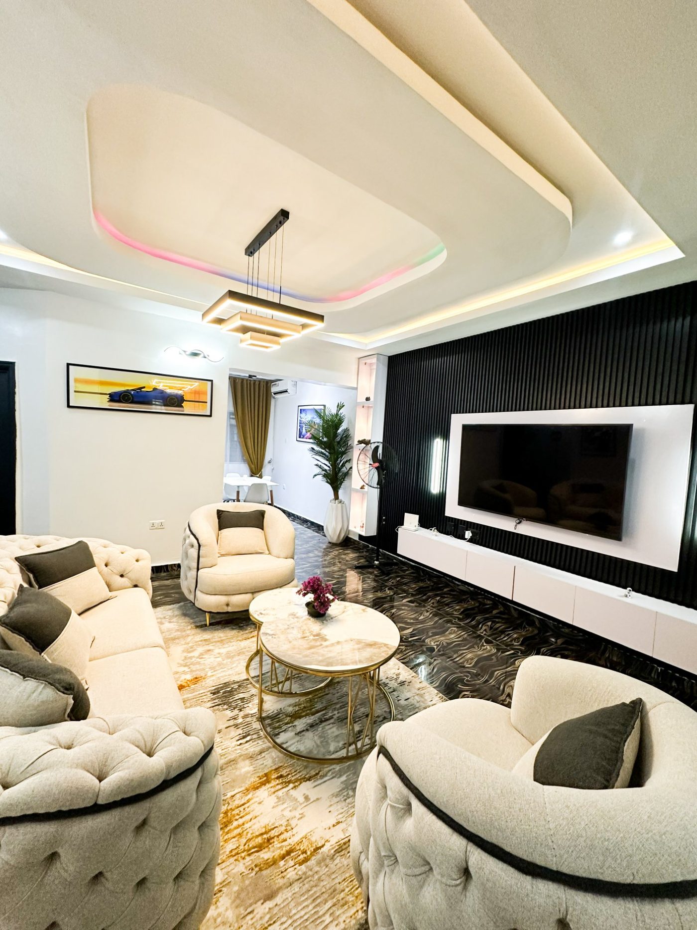 Atlas House 1-bedroom suite living area with pool table and designer lighting